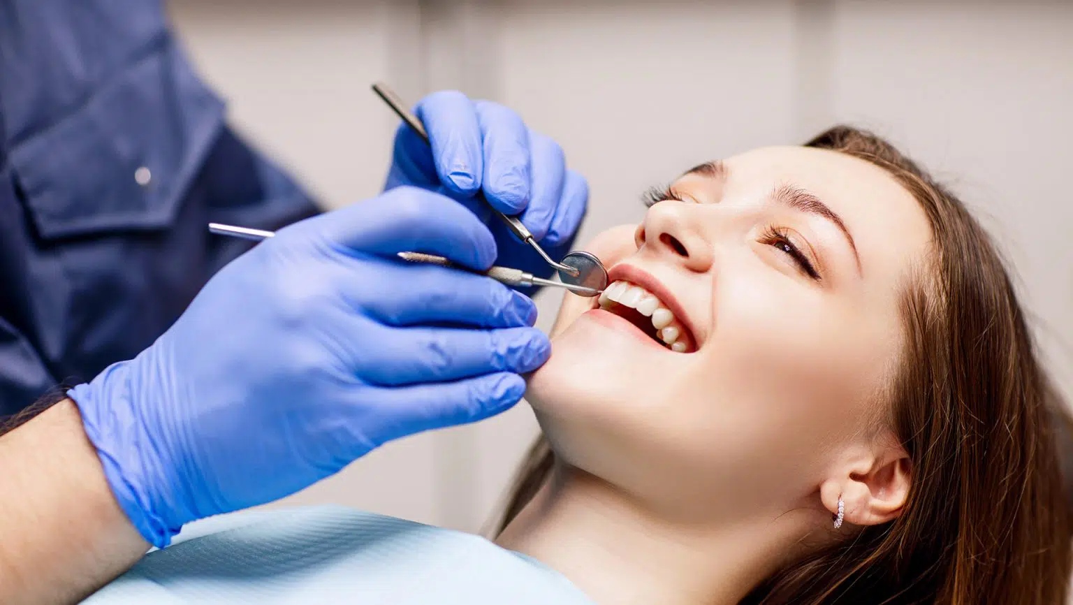 Young female getting dental cleaning in Chandler, AZ | Smiles of Chandler
