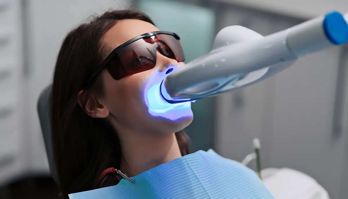 Young woman getting teeth Whitening treatment in Chandler, AZ | Smiles of Chandler