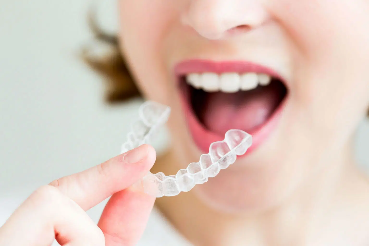 Woman Holding Invisalign | Smiles of Chandler in Chandler, AZ